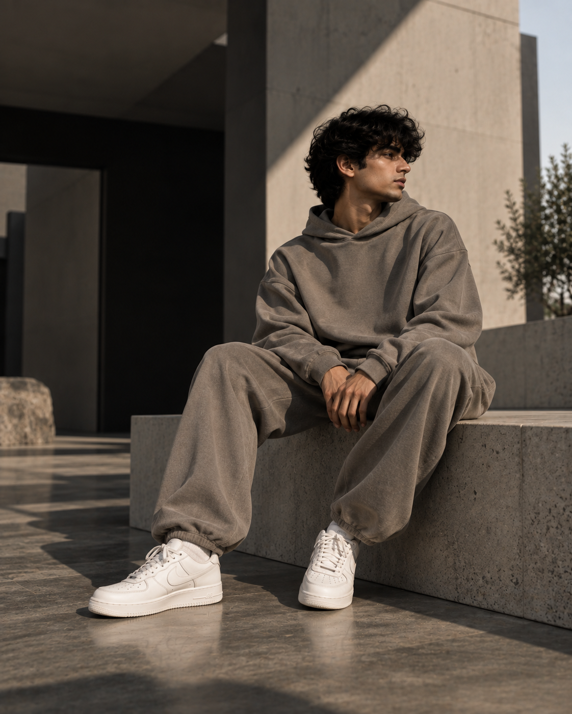 Model wearing a premium neutral co-ord set in a minimalist urban setting - VELNOR™